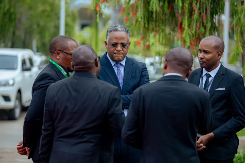 Herbert Lyimo of Maxie Consult (right) in conversation at an event