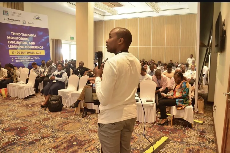 Herbert Lyimo of Maxie Consult speaking at the Third Tanzania Monitoring, Evaluation and Learning Conference